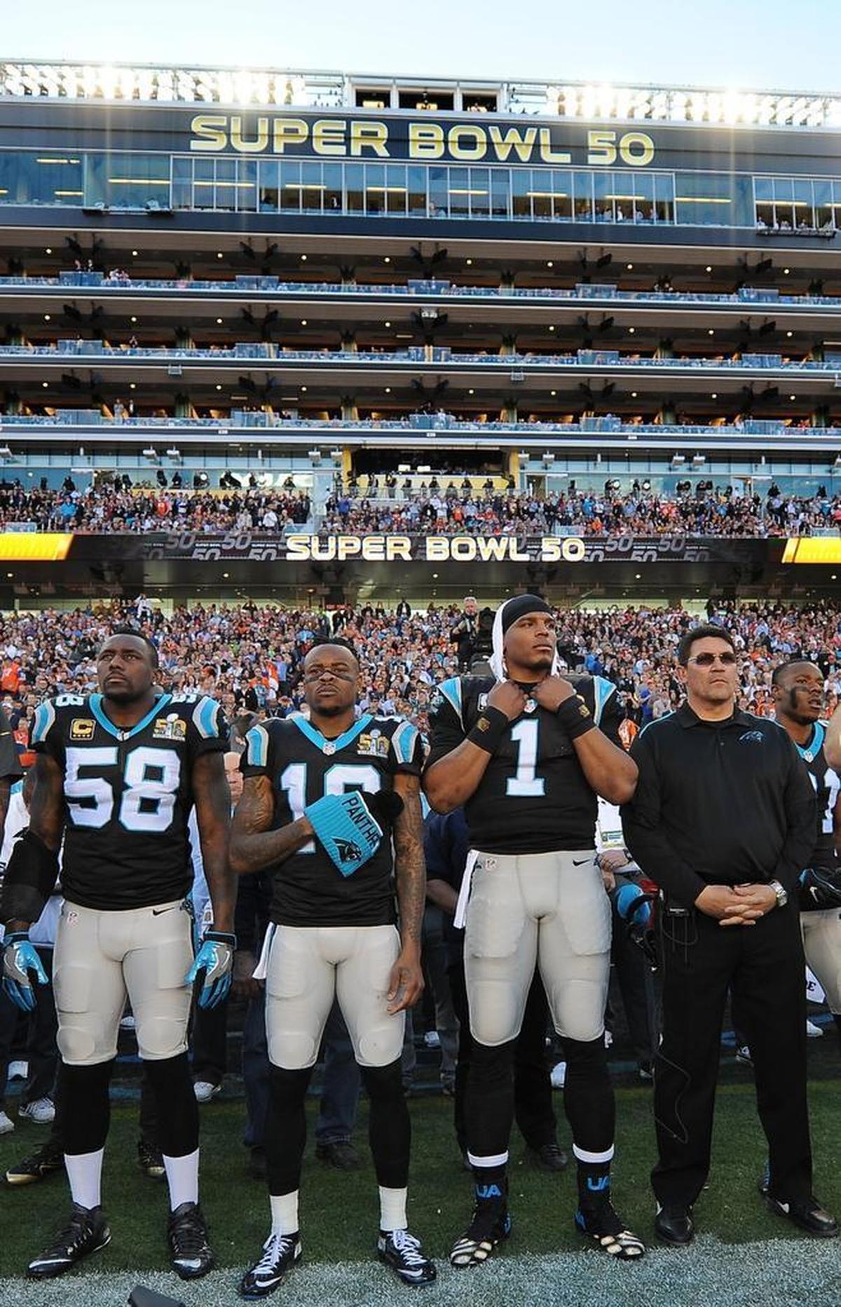 Shortly before Super Bowl 50, Panthers head coach Ron Rivera (right) and Cam Newton (1) stood together at the sideline just before the national anthem played.