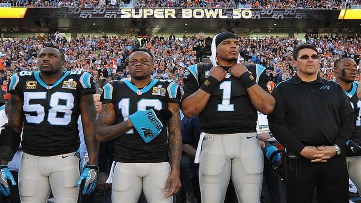 Shortly before Super Bowl 50, Panthers head coach Ron Rivera (right) and Cam Newton (1) stood together at the sideline just before the national anthem played.