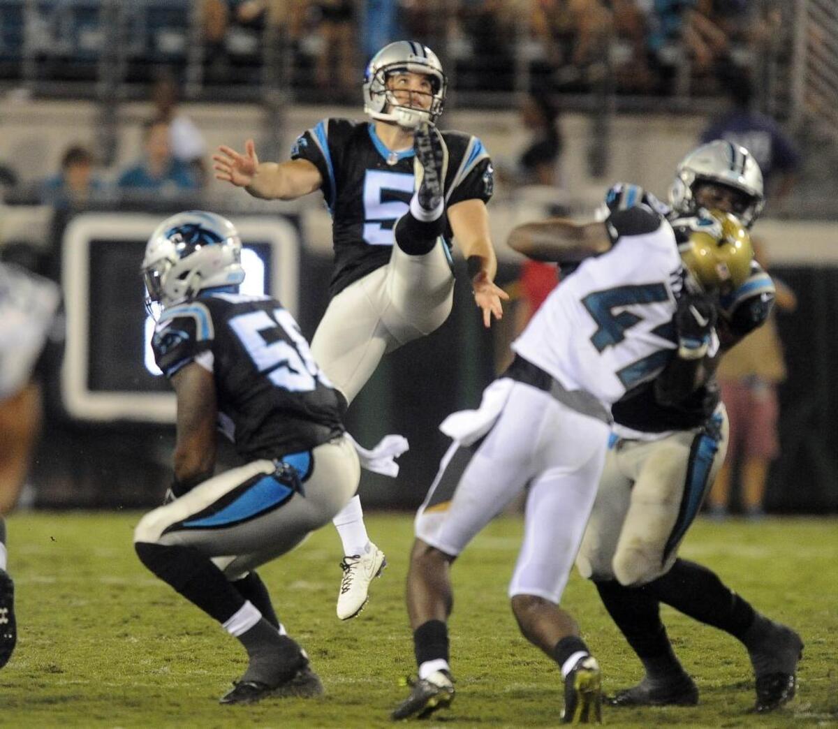 The Carolina Panthers’ Michael Palardy (5) watches his punt against the Jacksonville Jaguars in their preseason game at Jacksonville in August. The Panthers won 24-23.