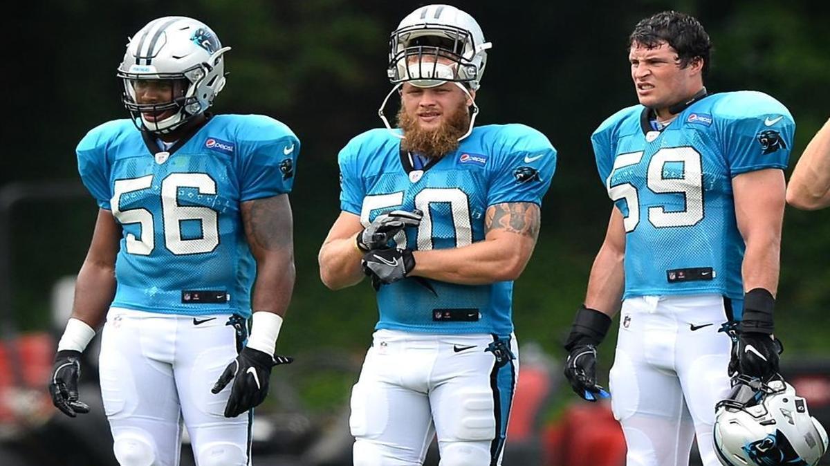 Carolina Panthers linebackers Zeke Bigger, left, Ben Boulware, center and Luke Kuechly, right, watch the team run through drills during practice on Friday, July 28, 2017 at Wofford College in Spartanburg, SC.