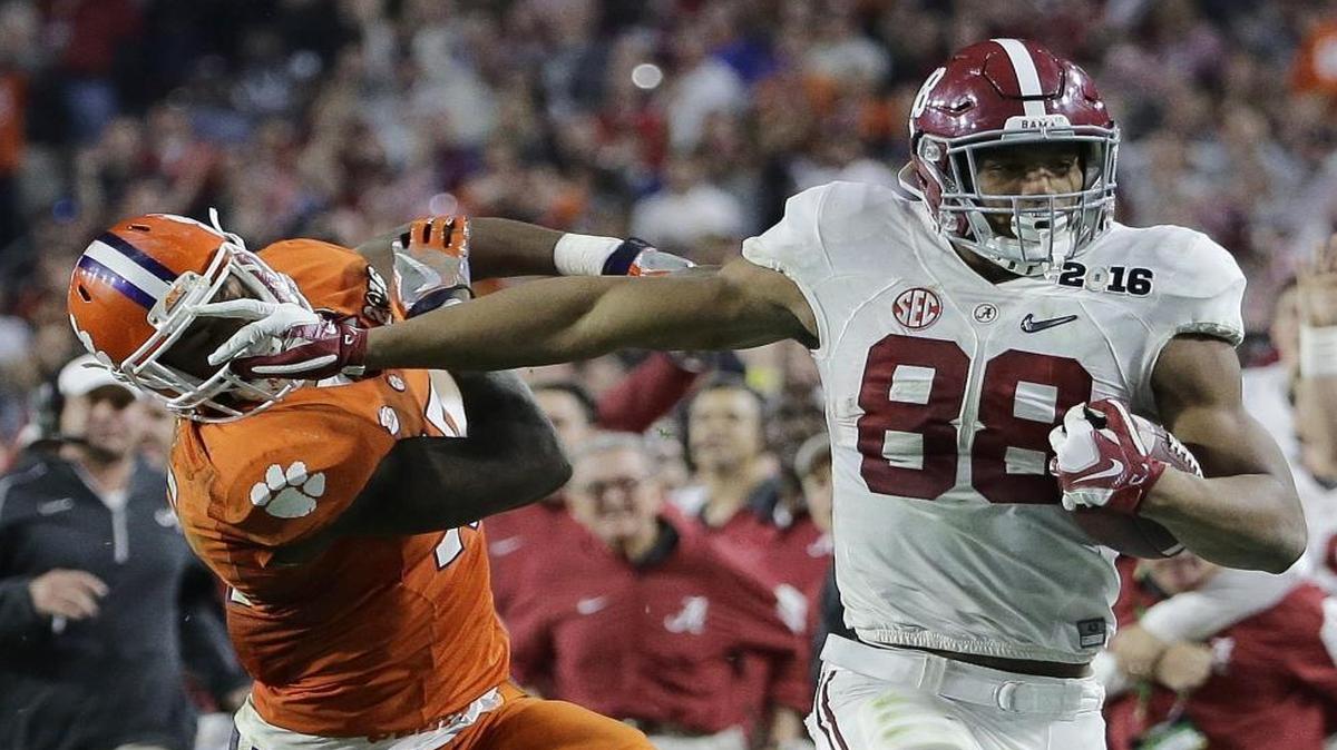 FILE - In this Jan. 11, 2016, file photo, Alabama's O.J. Howard tries to get past Clemson's T.J. Green after a catch during the second half of the NCAA college football playoff championship game, in Glendale, Ariz. This year's deep class includes Alabama's O.J. Howard and Miami's David Njoku. (AP Photo/David J. Phillip, File)