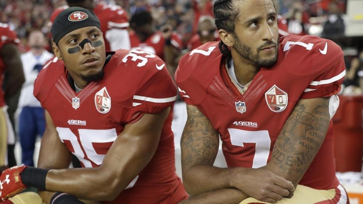 Political statements such as the one being made by San Francisco 49ers safety Eric Reid (35) and quarterback Colin Kaepernick (7) during the national anthem should not be a part of sports, Panthers coach Ron Rivera says.