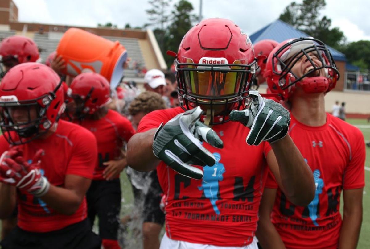 Nation Ford High School celebrates after winning the Cam Newton Foundation’s 7-on-7 championship at Providence Day School.