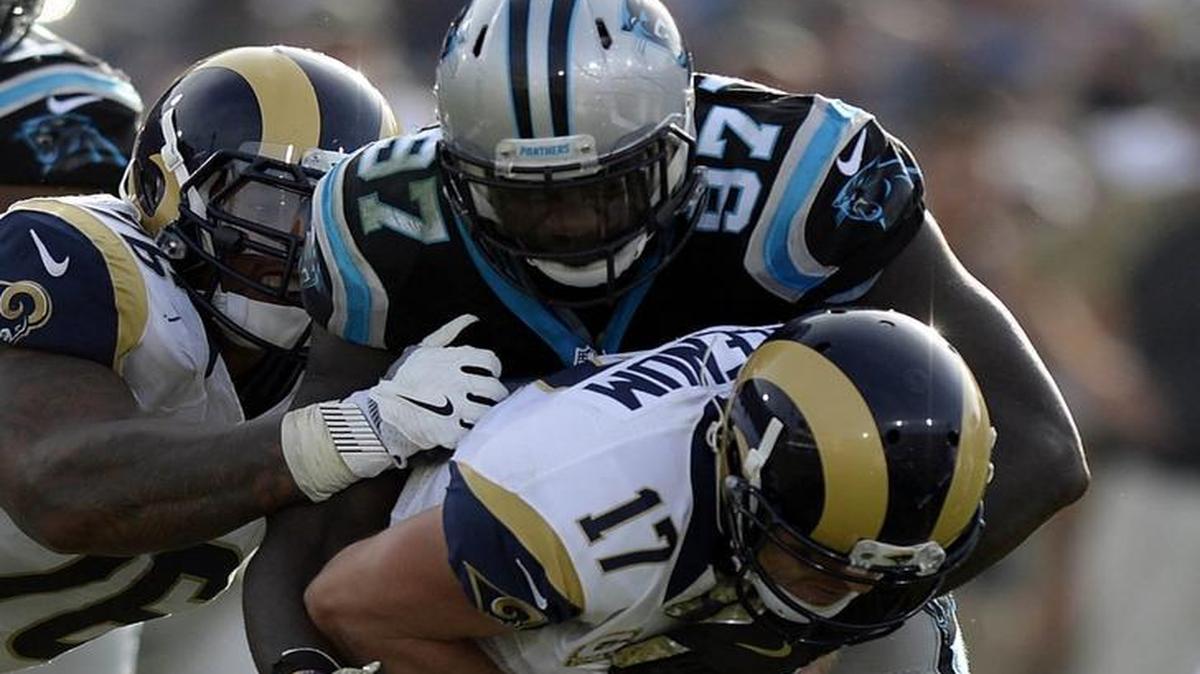 Carolina Panthers defensive end Mario Addison (97) gathered two of the Panthers’ four sacks as the suddenly resurgent defense had the crowd at L.A. Memorial Coliseum turning against Rams quarterback Case Keenum (17) .