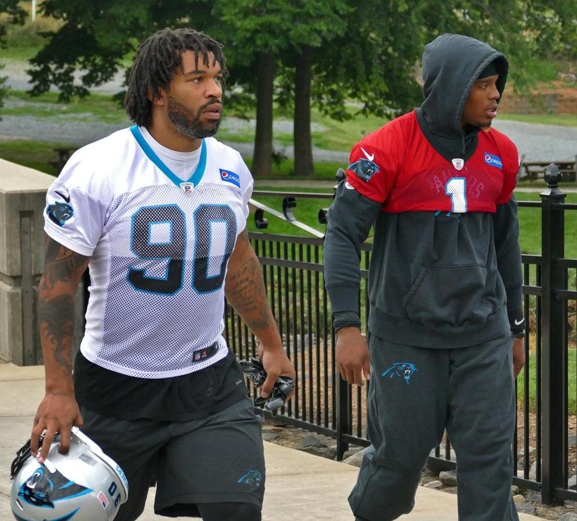Julius Peppers (90) and Cam Newton are two of the more iconic players in Carolina Panthers’ history. Now they’re teammates for at least one season.