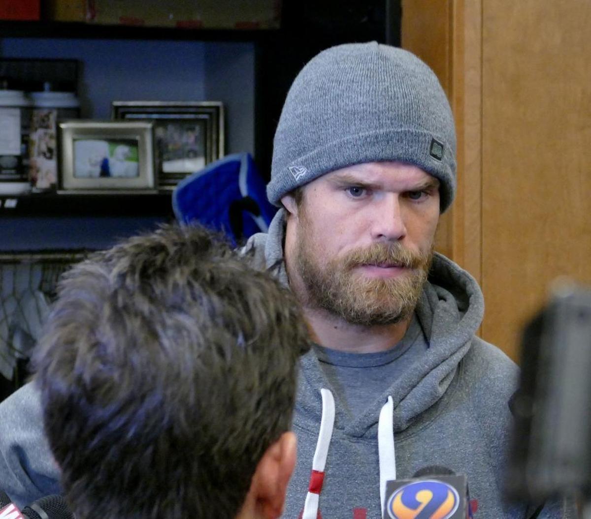 Carolina Panthers tight end Greg Olsen speaks with reporters as he and his teammates cleaned out lockers at Bank of America Stadium a day after the wild-card playoff loss to the New Orleans Saints.