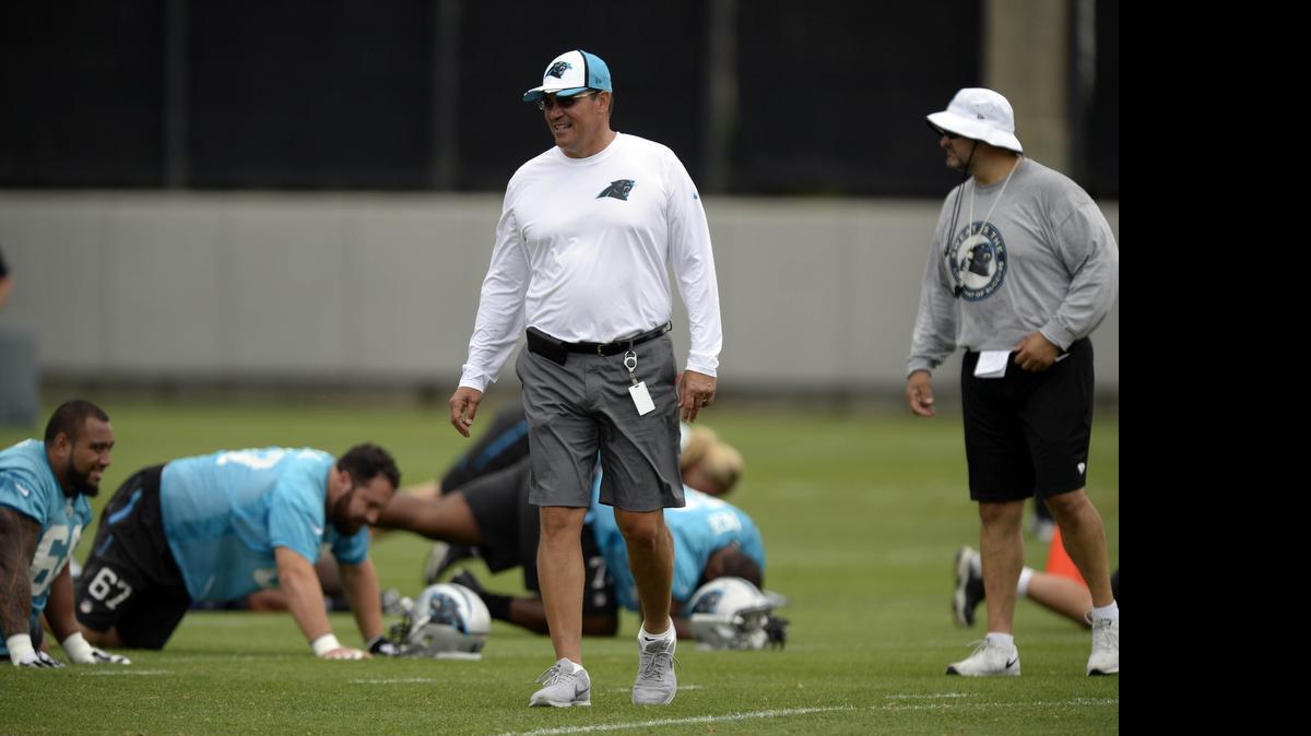 
Carolina Panthers head coach Ron Rivera, center, on practicing next month with the Miami Dolphins: “It’ll give us the opportunity to look at somebody different.”
