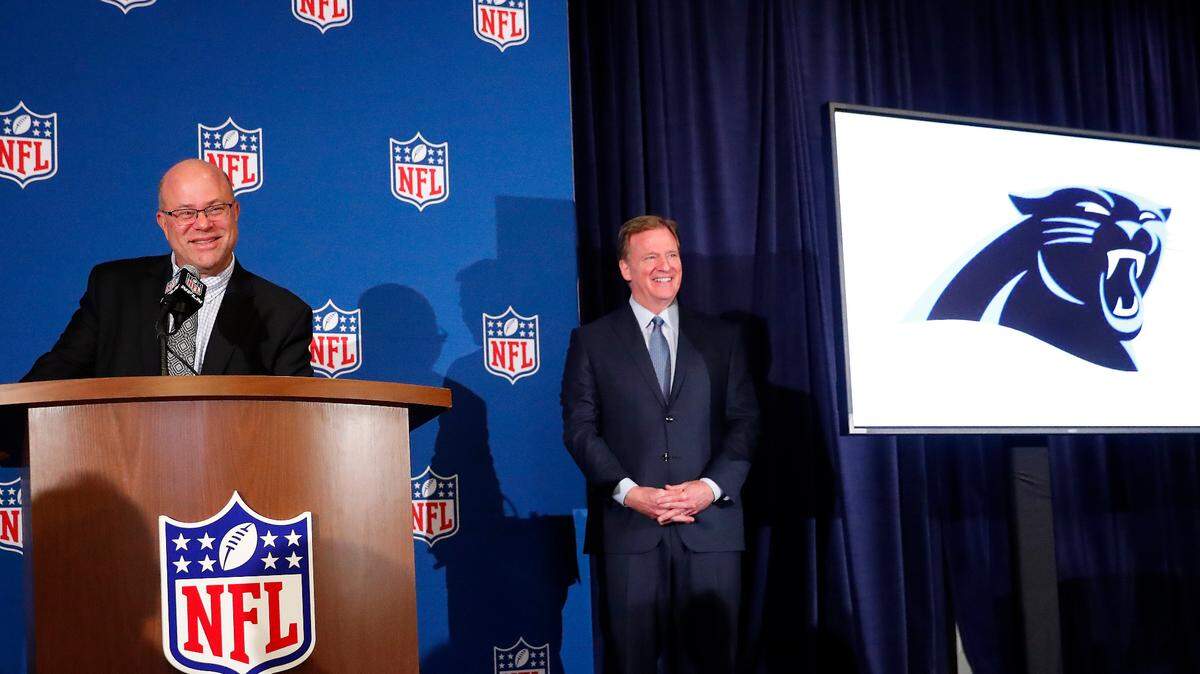 David Tepper, left, speaks as NFL commissioner Roger Goodall looks on during a news conference where he was introduced as the new owner of the Carolina Panthers at the NFL owners spring meeting Tuesday, May 22, 2018, in Atlanta. (AP Photo/John Bazemore)