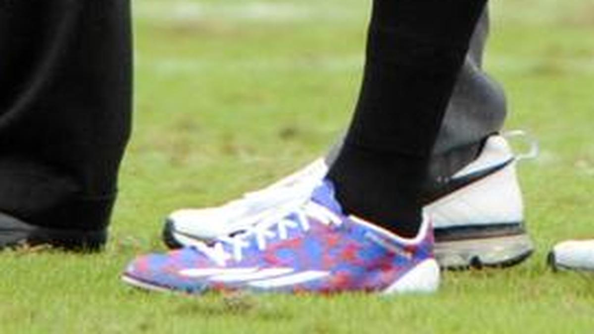 Carolina Panthers cornerback Josh Norman (24) expects to be fined for wearing these red, white and blue cleats on Sunday.
