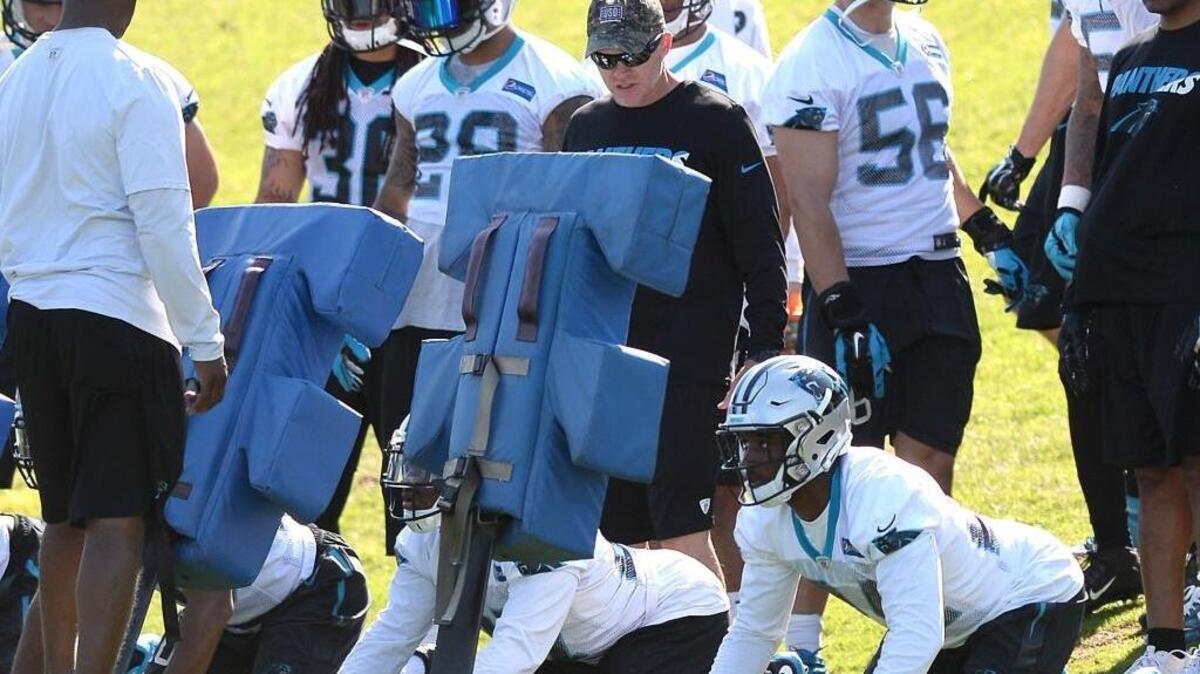 The Carolina Panthers’ Sean McDermott, center, is the only NFL defensive coordinator to oversee to top-10 defense each of the past four seasons.