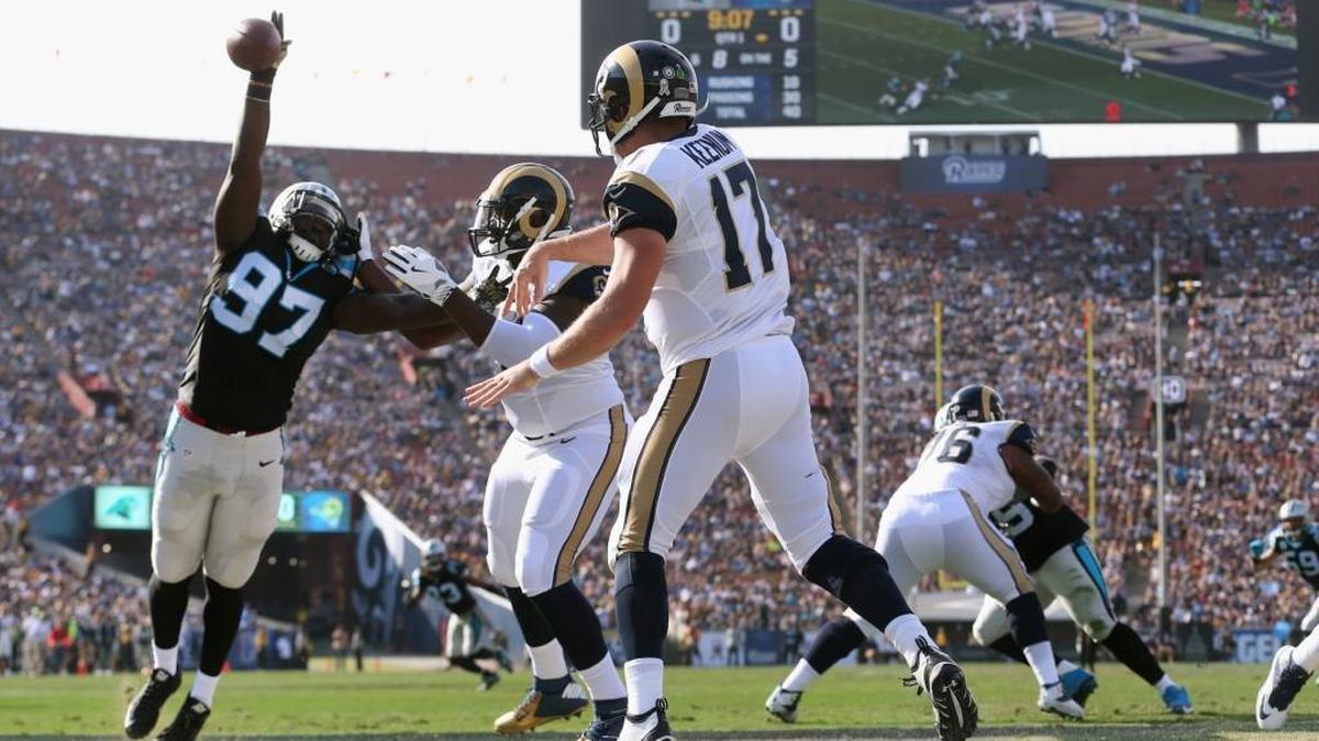 Carolina Panthers defensive end Mario Addison blocks a pass Sunday by Los Angeles Rams quarterback Case Keenum in the end zone at the Los Angeles Memorial Coliseum.