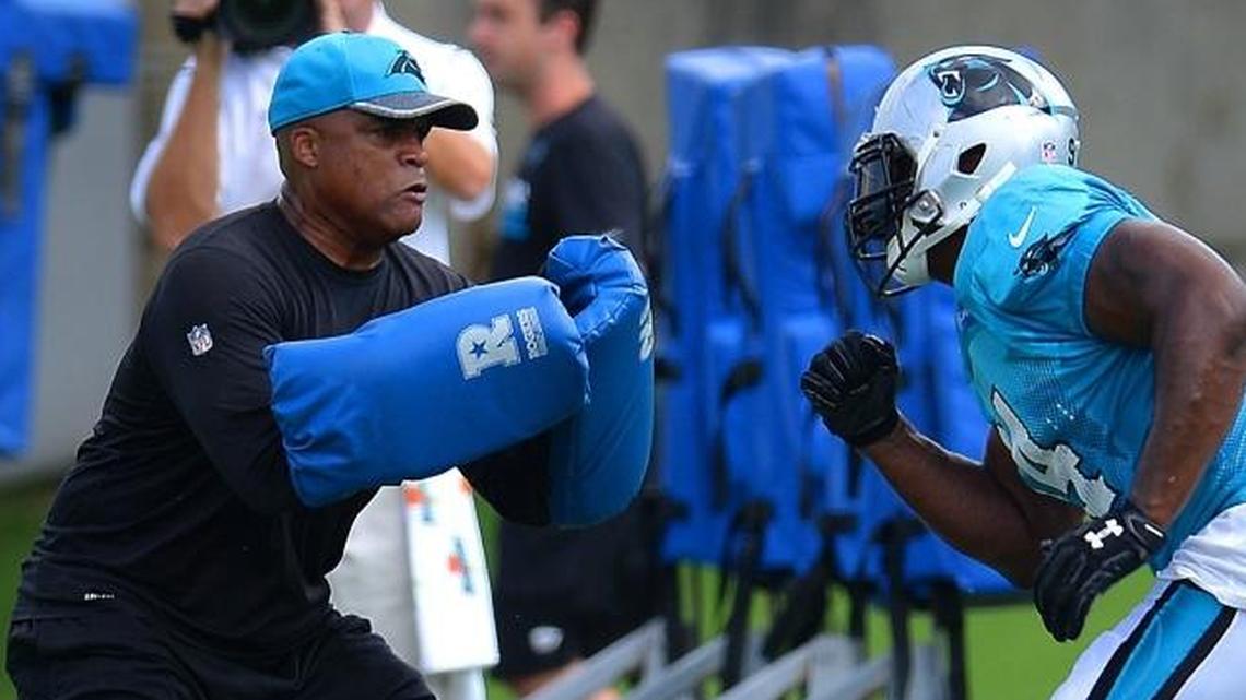 Carolina Panthers defensive line coach Eric Washington, left, turned defensive coordinator on Monday after the departure of Steve Wilks for Arizona’s head coaching job. Washington has the look of an NFL head coach, too.