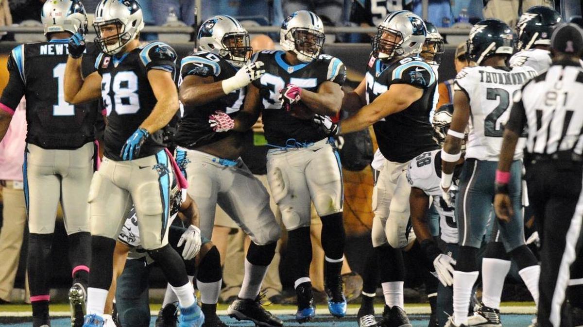 Carolina Panthers' Mike Tolbert (35) celebrates his touchdown against the Philadelphia Eagles in the first quarter at Bank of America Stadium on Sunday.