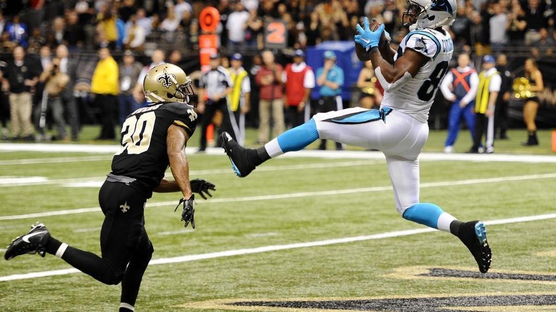 Carolina Panthers receiver Jerricho Cotchery (82) hauls in the game-winning touchdown past New Orleans Saints' Chris Owens (30) late in Sunday’s game at Mercedes-Benz Superdome . The Panthers won 41-38, and improve to 12-0.