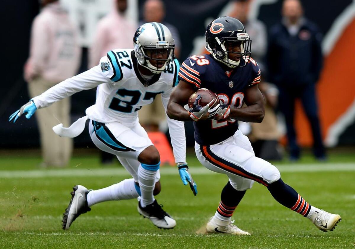 Chicago Bears running back Tarik Cohen, right, catches a pass from quarterback Mitchell Trubisky as Carolina Panthers cornerback Kevon Seymour, left, chases during second quarter action on Sunday, October 22, 2017 at Soldier Field.