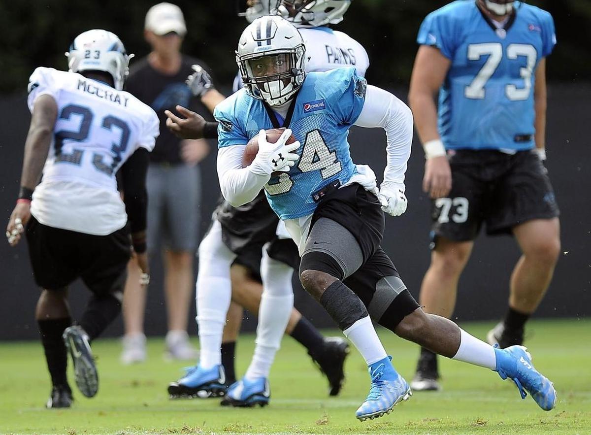 Carolina Panthers running back Cameron Artis-Payne (34) runs upfield at training camp at Wofford College in Spartanburg, SC on Sunday, August 13, 2017.