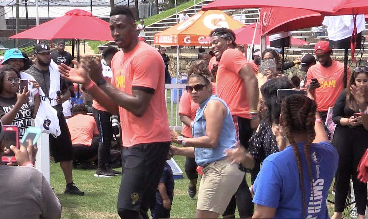 Charlotte Hornets Dwight Howard and Carolina Panthers Cam Newton line dance while taking a break at the 4th annual Kicking It With Cam! Celebrity Kickball Tournament benefiting local and deserving youth in the areas of education, physical fitness and wellness at American Legion Memorial Stadium on Friday, June 1, 2018.