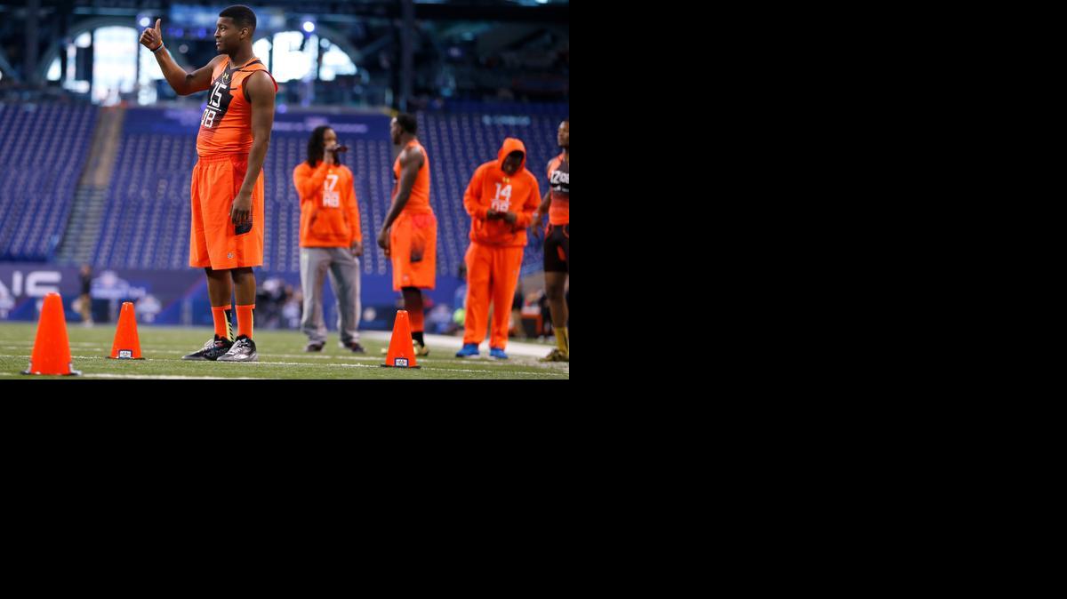 
Florida State quarterback Jameis Winston gestures at a camera before running a drill at the NFL football scouting combine in Indianapolis on Saturday.
