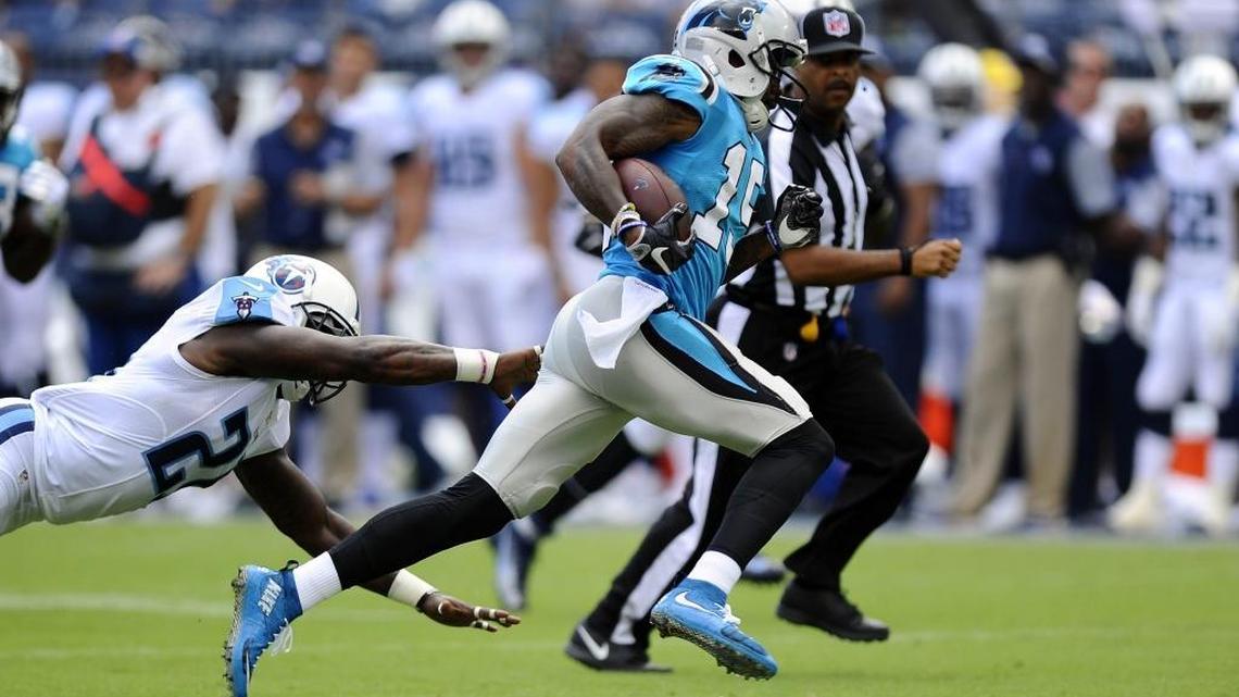 Carolina Panthers wide receiver Ted Ginn, Jr (19) races past Tennessee Titans strong safety Da'Norris Searcy (21) on his way to a touchdown in the first half at Nissan Stadium in Nashville, TN during their pre-season game on Saturday, August 20, 2016. The Panthers won 26-16.