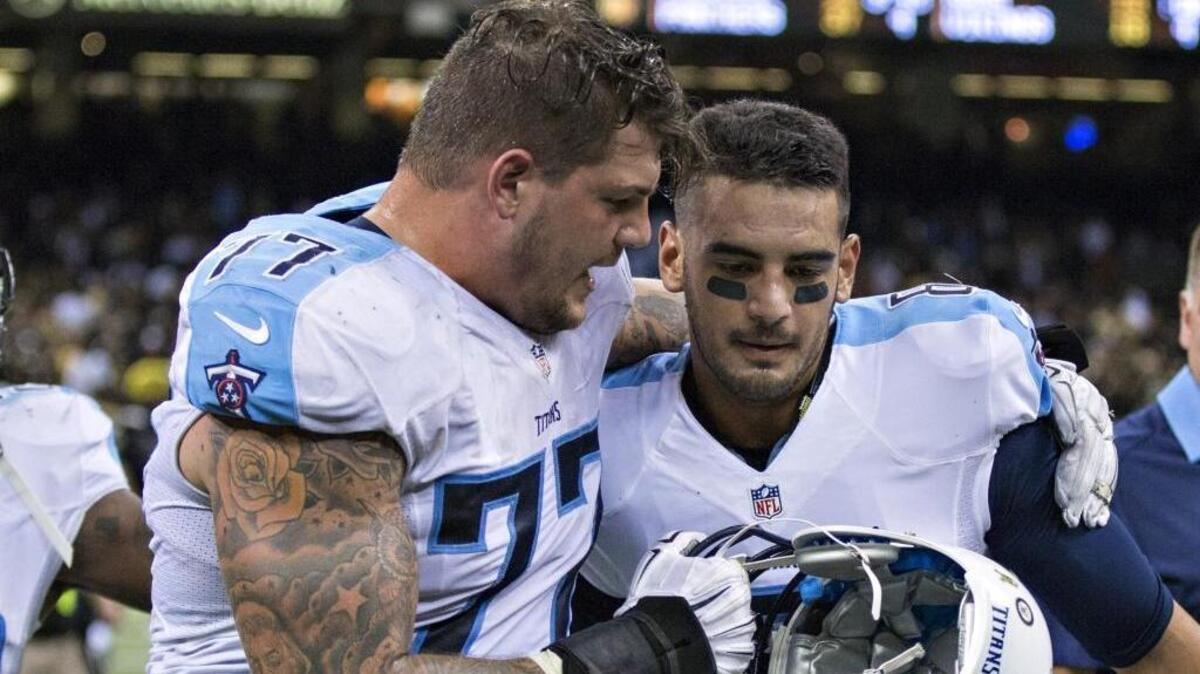 Tennessee Titans quarterback Marcus Mariota (right) has a set of run-pass option plays with college roots at his disposal. Sunday, the Carolina Panthers have to deal with them.