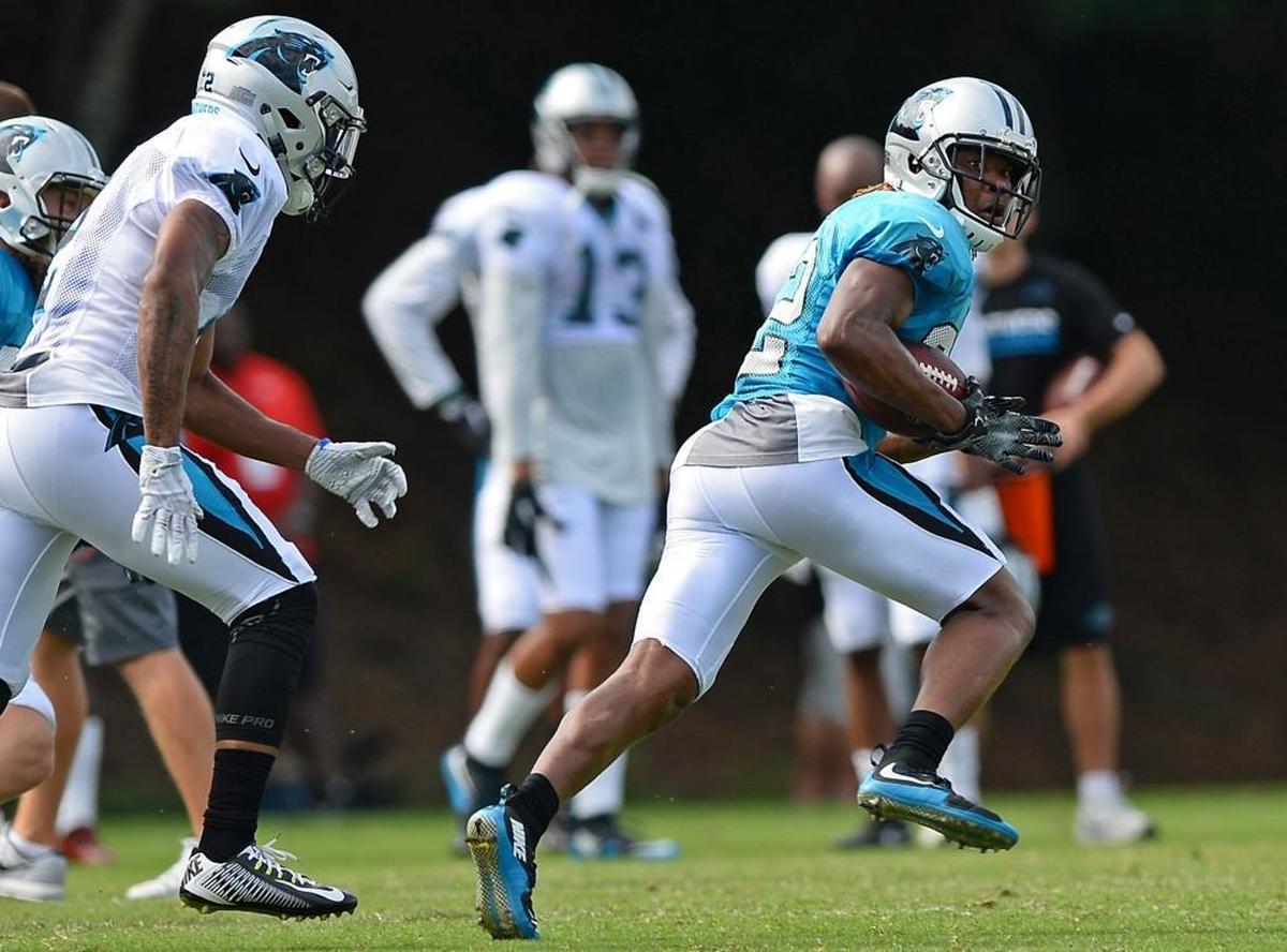 Carolina Panthers cornerback Cole Luke, right, glances over his shoulder after intercepting a pass during practice on Saturday, July 29, 2017 at Wofford College in Spartanburg, SC.