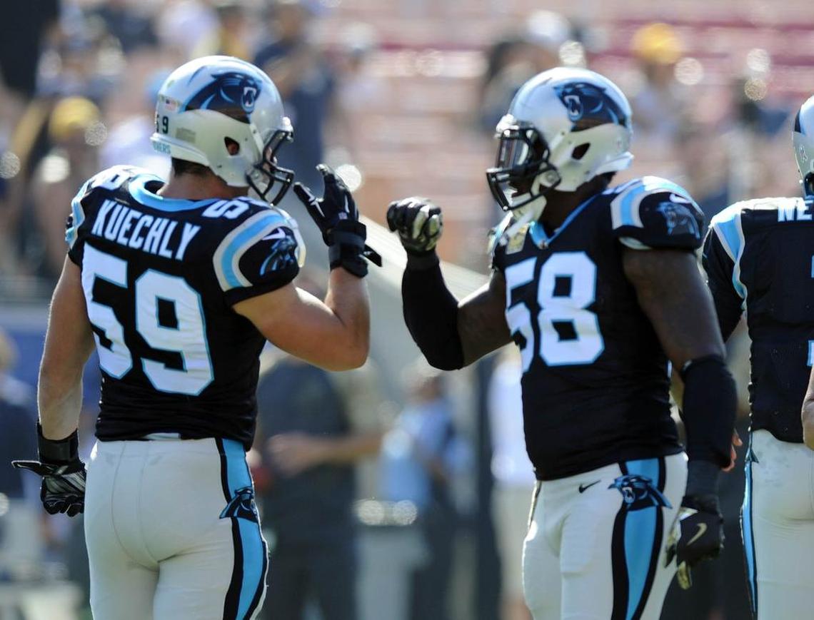 Former Carolina Panthers linebackers Luke Kuechly (59) and Thomas Davis (58) greet each other during warmups prior to playing the Los Angeles Rams at Los Angeles Memorial Coliseum in Los Angeles, CA on Sunday, November 6, 2016.