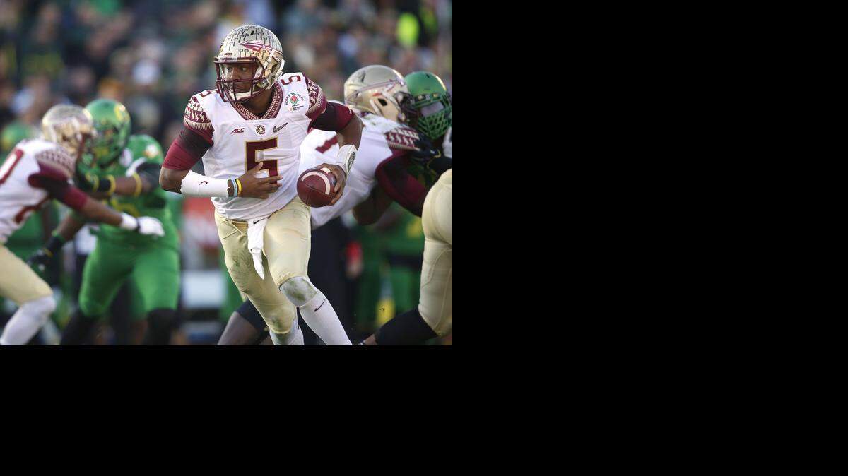 
Florida State quarterback Jameis Winston prepares to hand the ball off while facing Oregon in the Rose Bowl on Jan. 1 in Pasadena, Calif. Winston is projected to be among the top picks in the upcoming NFL draft.
