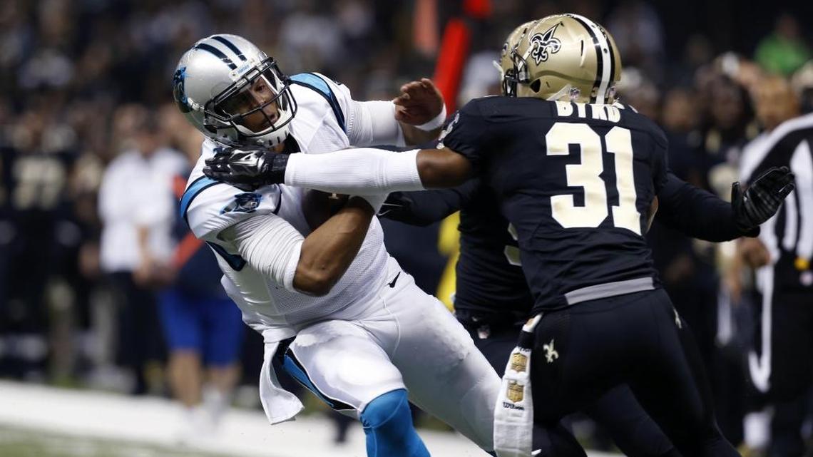 Carolina Panthers quarterback Cam Newton (left) is tackled by New Orleans Saints free safety Jairus Byrd in the first half of an NFL game in New Orleans in December 2015.