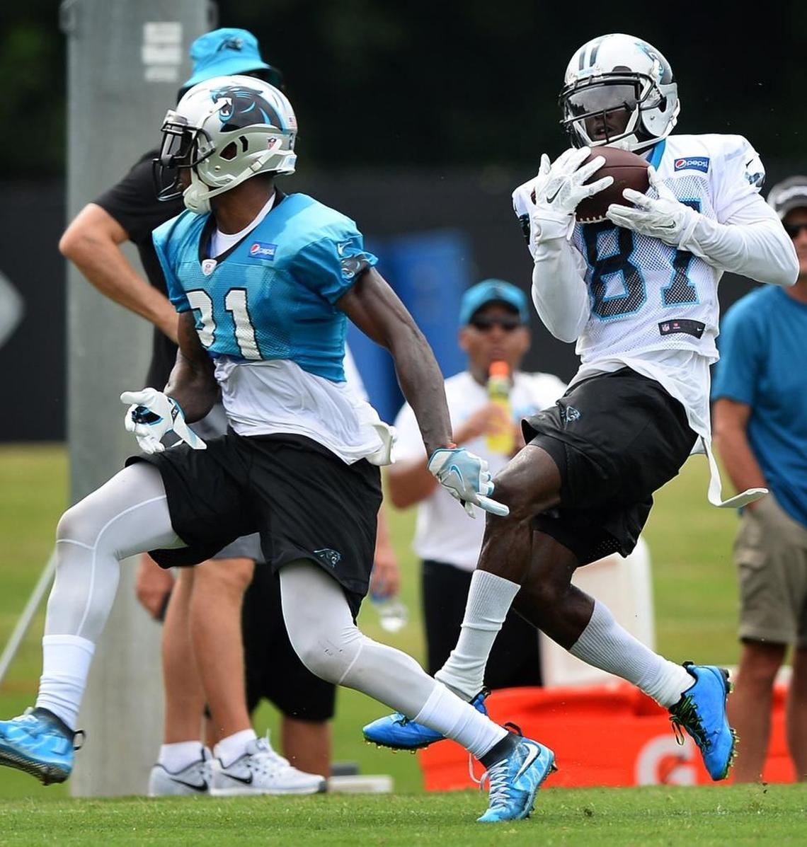 Carolina Panthers wide receiver Trevor Graham, right, catches a pass as cornerback Teddy Williams, left, passes by during practice on Thursday, August 3, 2017 at Wofford College in Spartanburg, SC.