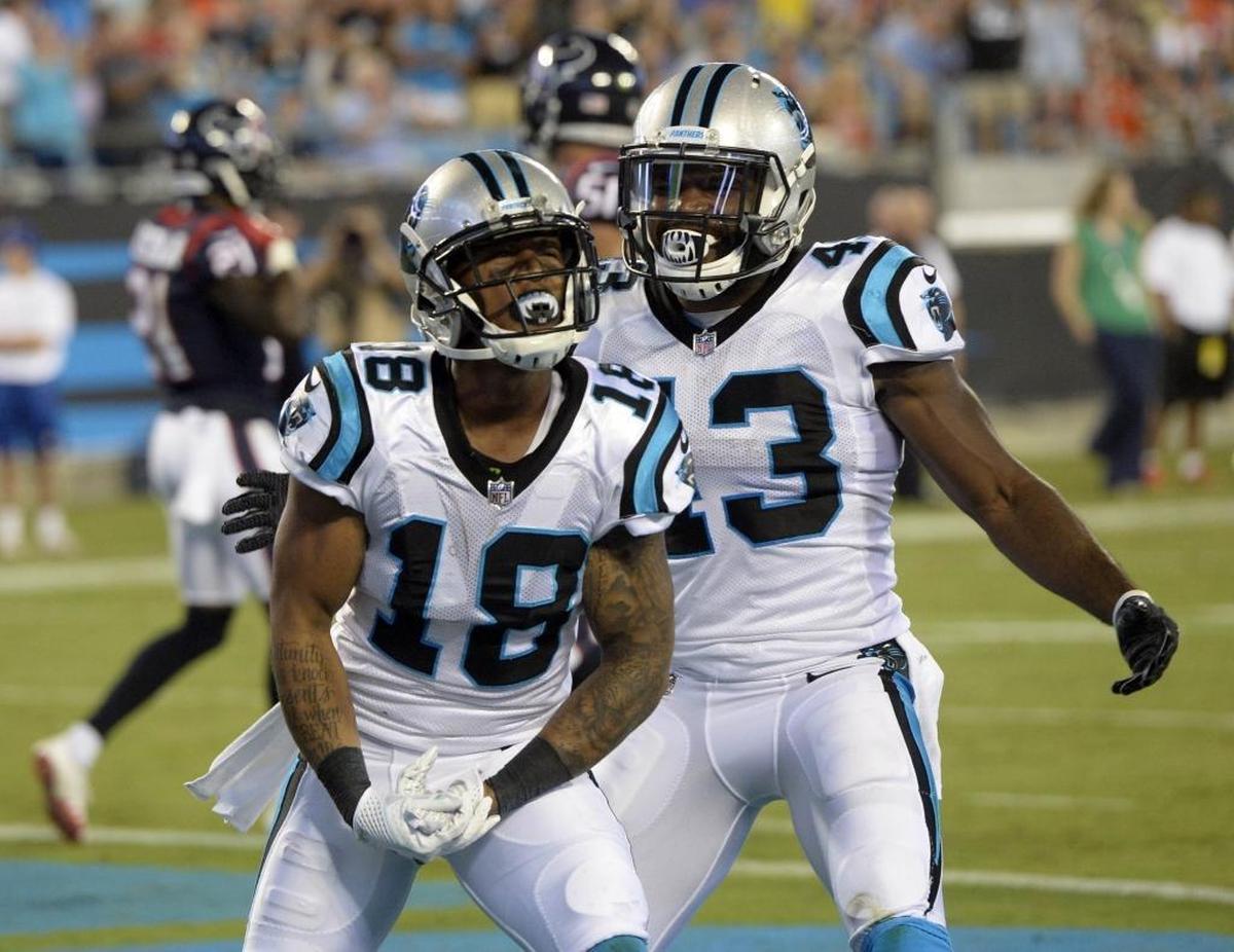 Carolina Panthers wide receiver Damiere Byrd (18) celebrates with running back Fozzy Whittaker (43) Wednesday. Byrd scored two TDs and had 98 yards receiving in Carolina’s 27-17 win over Houston.
