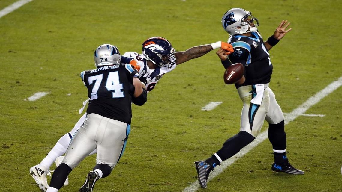 Denver Broncos linebacker Von Miller (58) beats Carolina offensive tackle Mike Remmers (74) for a strip-sack of quarterback Cam Newton (1) in the fourth quarter of Super Bowl 50.