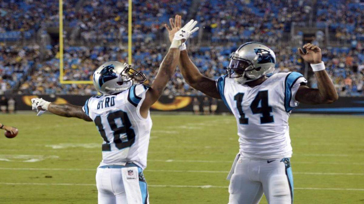 Carolina Panthers wide receiver Damiere Byrd (18) ended up the beneficiary of a long Kaelin Clay reception resulting in a 13-yard touchdown on a pass from Joe Webb (14). Above, Byrd and Webb celebrate after the score.