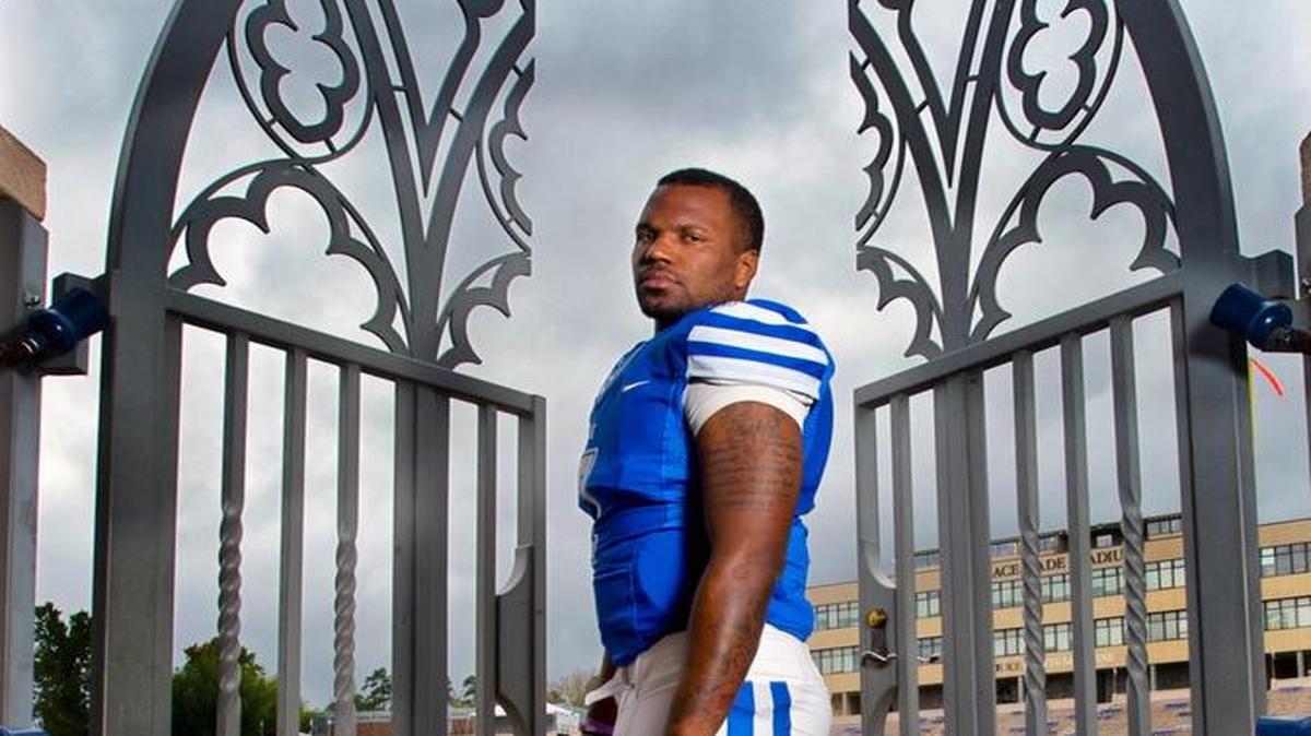 Duke quarterback Anthony Boone stands poised at the gates leading onto the field at Wallace Wade Stadium on Oct. 14, 2014 in Durham.