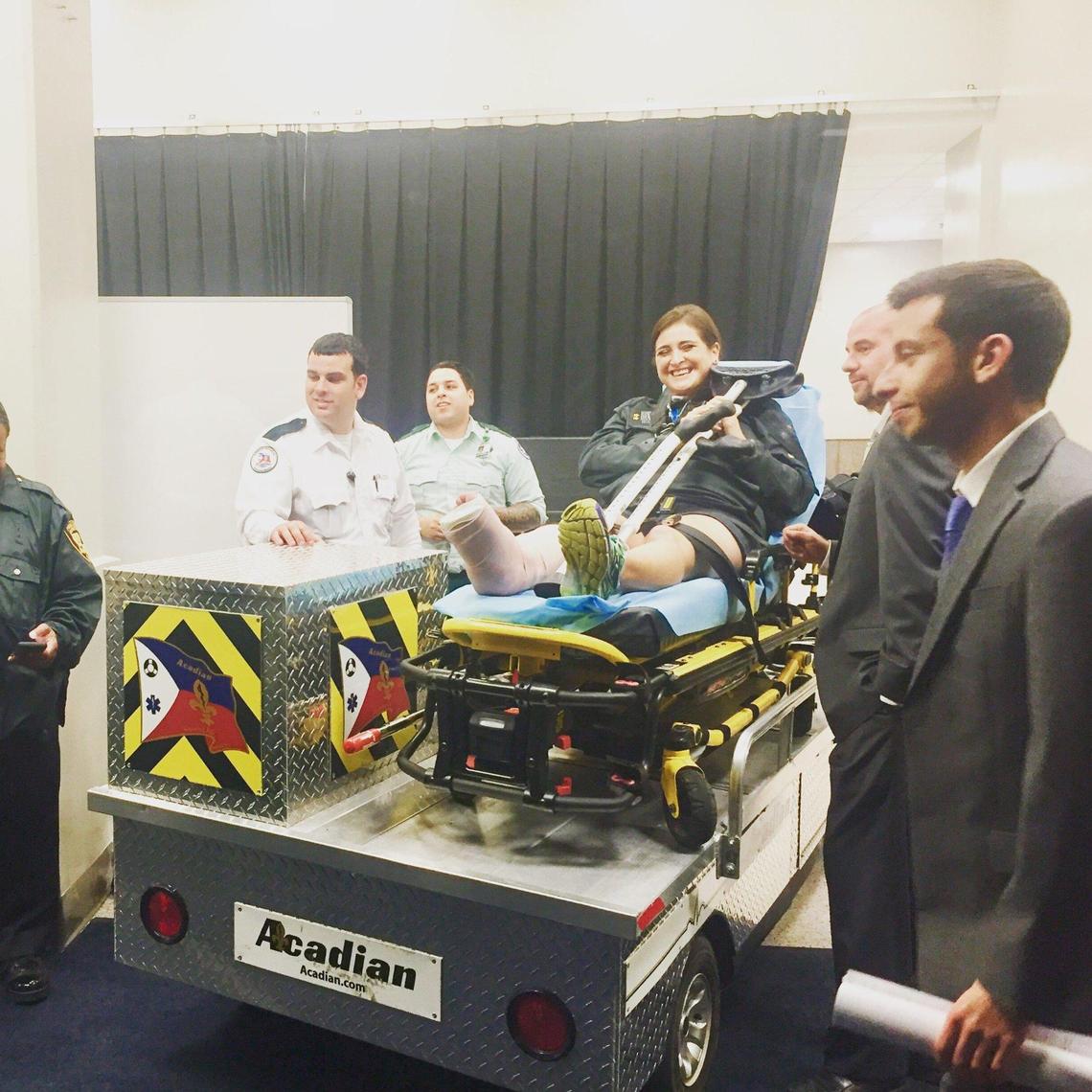 Melissa rests on a gurney after being treated for her injuries in New Orleans in December 2015.