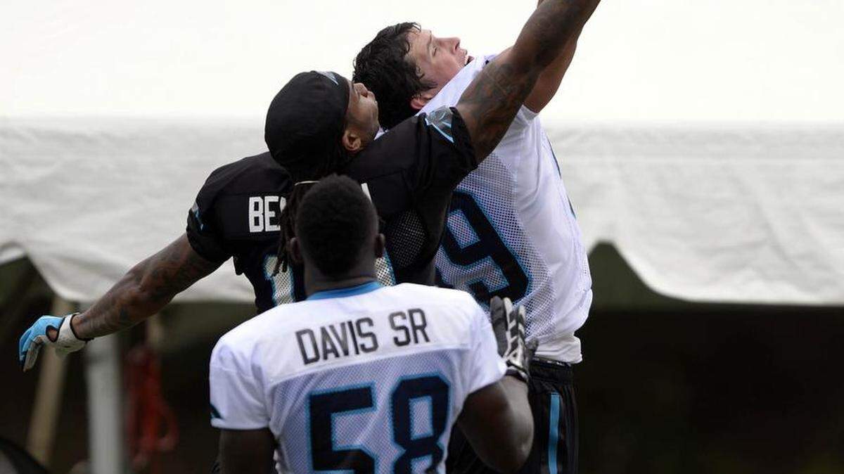 
Carolina Panthers' Kelvin Benjamin (13), Luke Kuechly (59) vie for a pass as Thomas Davis, Sr (58) looks on during a break at Carolina Panthers Training Camp at Wofford College in Spartanburg, S.C., on Sunday, Aug. 9, 2015.

