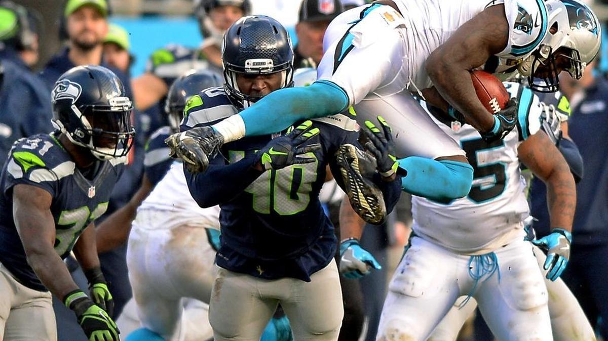 Carolina Panthers linebacker Thomas Davis recovers an onside kick by the Seattle Seahawks during the fourth quarter. The Panthers defeated the Seattle Seahawks in a NFC Divisional game, 31-24, on Sunday.