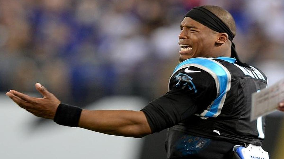 Carolina Panthers quarterback Cam Newton, left reacts with quarterbacks coach Ken Dorsey, right, to a call against the team at Baltimore.
