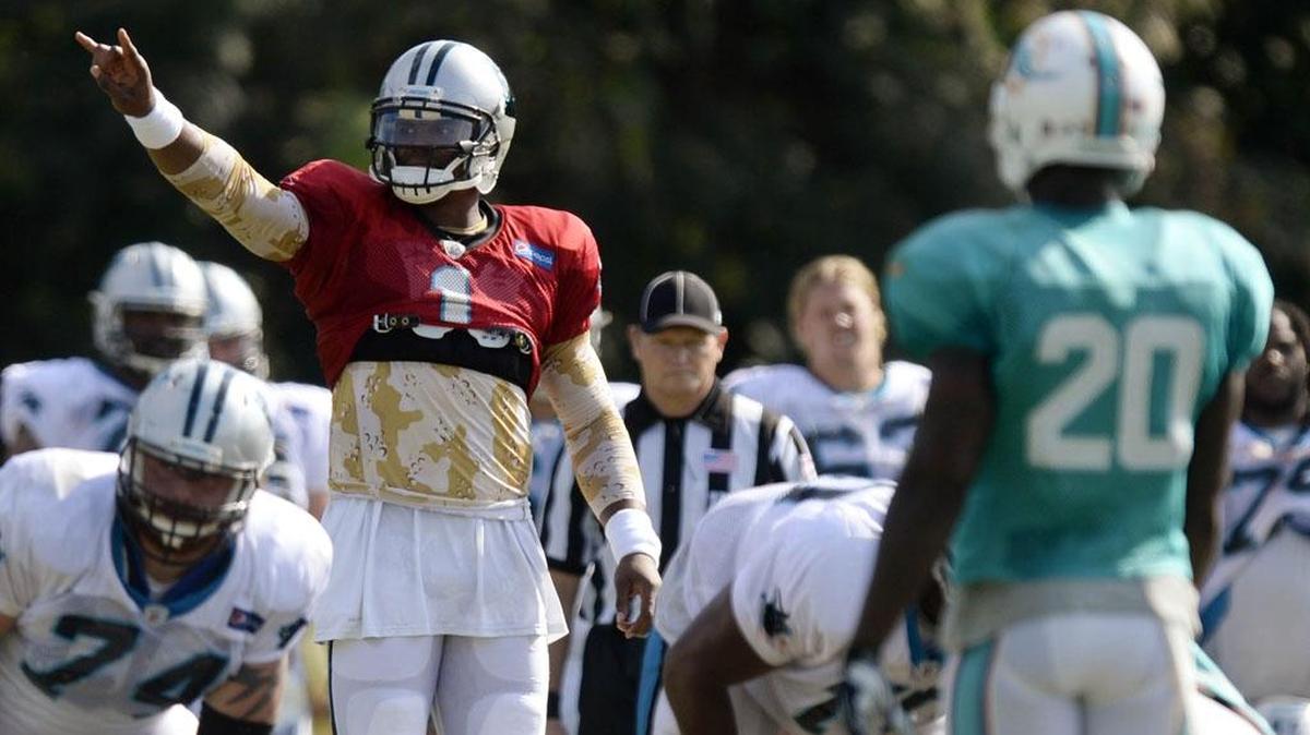 
Carolina Panthers quarterback Cam Newton (1) calls a play during a scrimmage against the Miami Dolphins at the Carolina Panthers training camp at Wofford College in Spartanburg, on Wednesday, Aug. 19, 2015.
