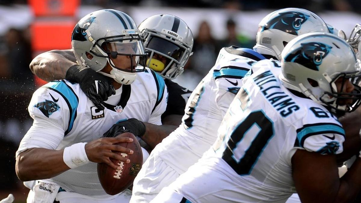 Carolina Panthers quarterback Cam Newton, left, is sacked by Oakland Raiders linebacker Bruce Irvin, right, during the second quarter. The Panthers fell 35-32 Sunday in a game that ended on another sack.