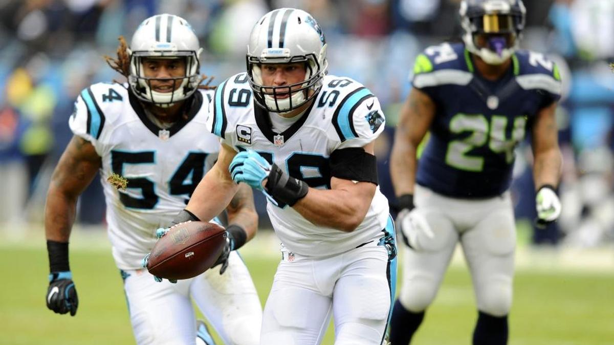 Carolina Panthers linebacker Luke Kuechly (59) heads to the end zone for a touchdown against the Seattle Seahawks in the first quarter of their NFC Divisional game at Bank of America Stadium on Jan. 17.