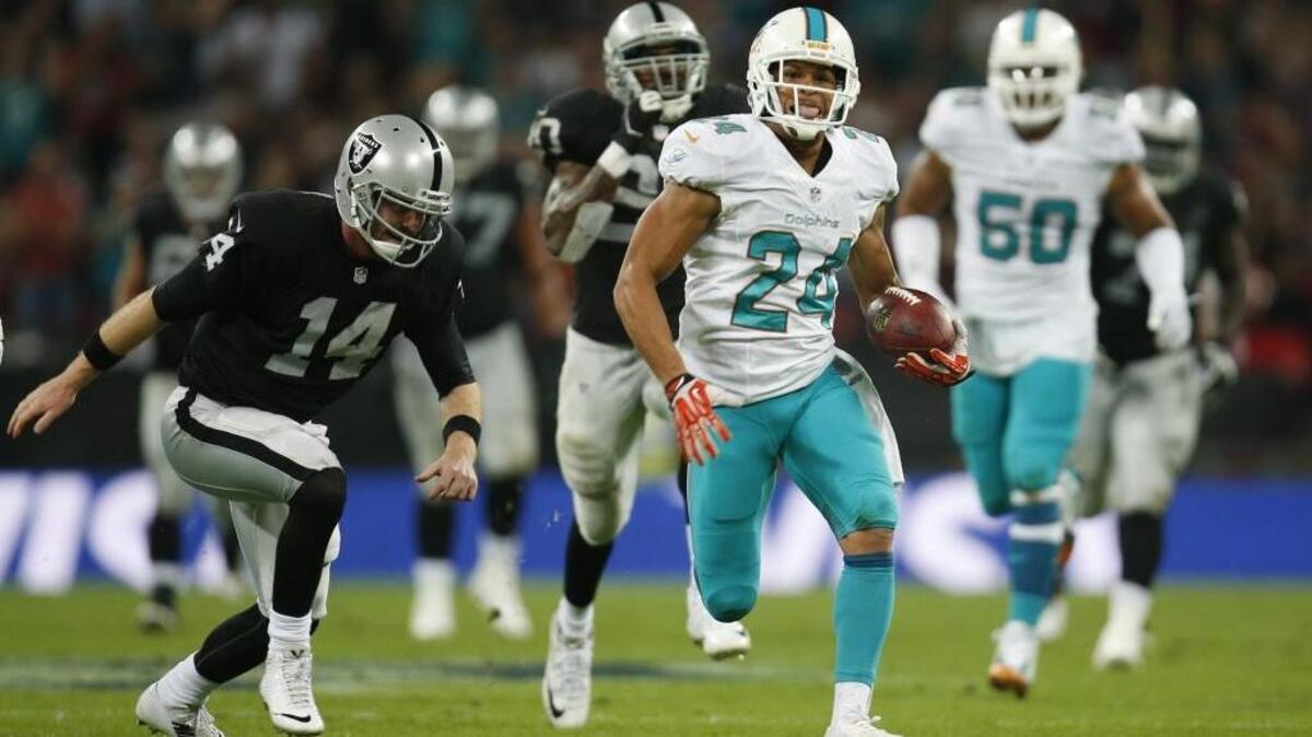 Former Miami Dolphins cornerback Cortland Finnegan (24) was signed by the Carolikna Panthers on Monday.