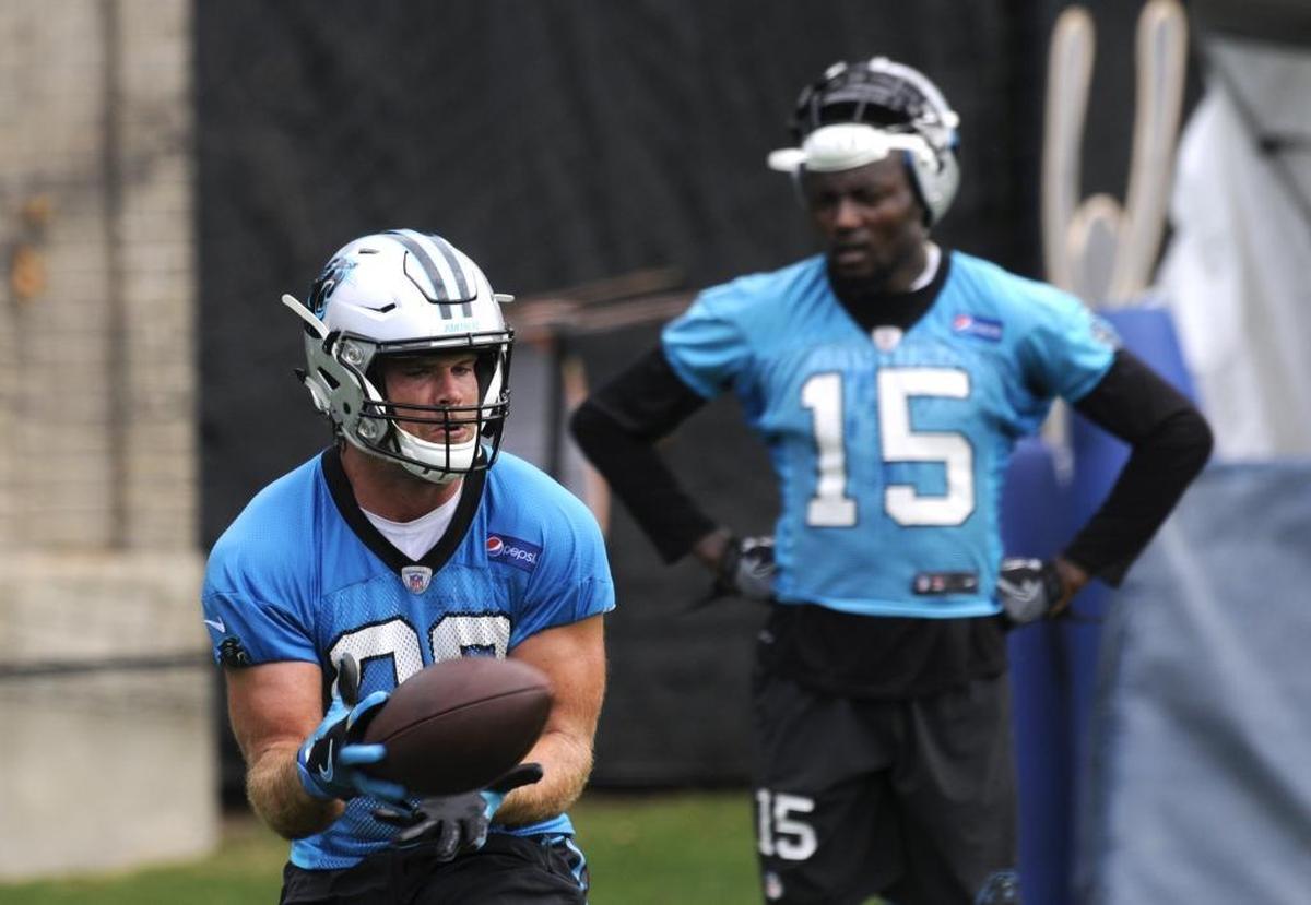 Panthers tight end Greg Olsen (88) catches a pass during receiver drills on the last day of mini-camp. Will he be in Spartanburg when the Panthers report for training camp?