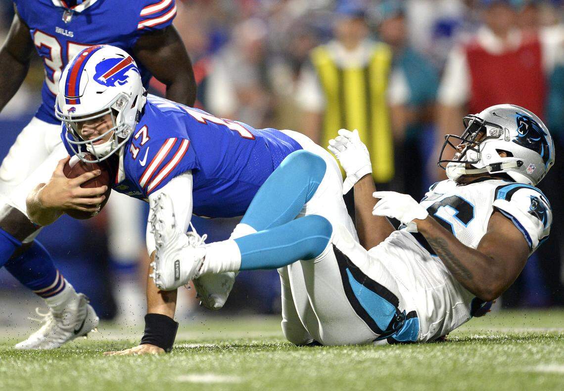 Buffalo Bills quarterback Josh Allen (17) is sacked by Carolina Panthers linebacker Jermaine Carter (56) during the second half of an NFL football game, Thursday, Aug. 9, 2018, in Orchard Park, N.Y. (AP Photo/Adrian Kraus)