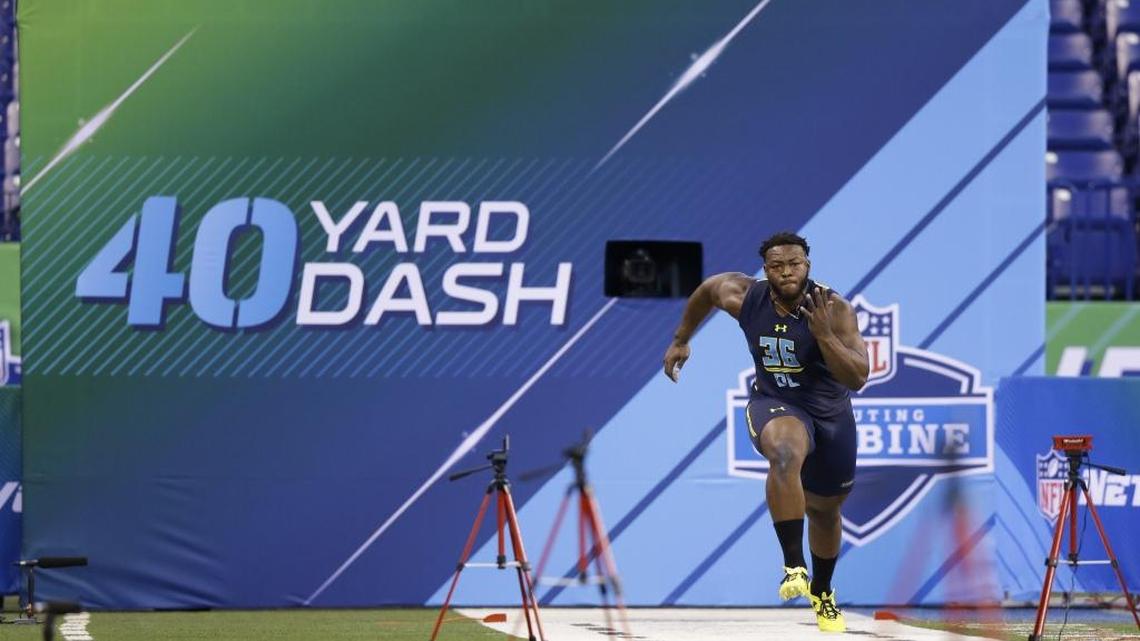 North Carolina Charlotte defensive lineman Larry Ogunjobi runs the 40-yard dash at the NFL football scouting combine in Indianapolis, Sunday, March 5, 2017. (AP Photo/Michael Conroy).