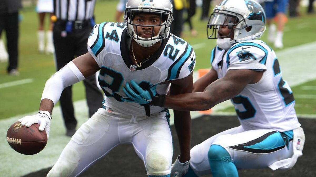 
Carolina Panthers cornerback Josh Norman, left, looks toward the stands as he and cornerback Bene Benwikere, right, celebrate Norman's interception of a pass by New Orleans Saints quarterback Luke McCown late in the fourth quarter. McCown's pass was meant for wide receiver Brandin Cooks in the end zone. The Panthers defeated the Saints 27-22.
