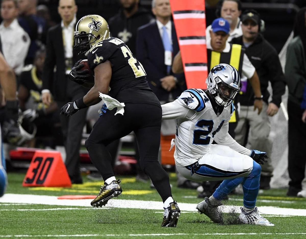 Carolina Panthers cornerback James Bradberry (24) reaches back to try to tackle New Orleans Saints running back Mark Ingram (22) during the first half at the Mercedes-Benz Superdome on Sunday, December 3, 2017. The Saints led, 21-14, at halftime.