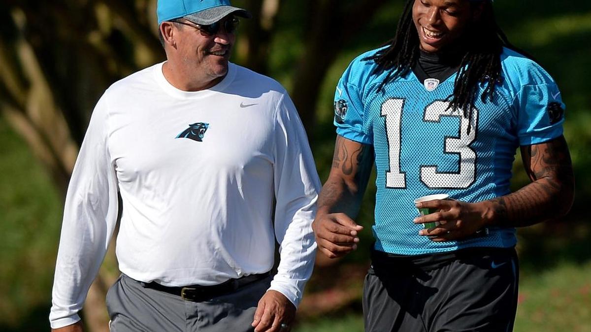 Carolina Panthers head coach Ron Rivera, left and wide receiver Kelvin Benjamin, right, talk as they walk to practice at Wofford College on Sunday, July 31, 2016 in Spartanburg, S.C.