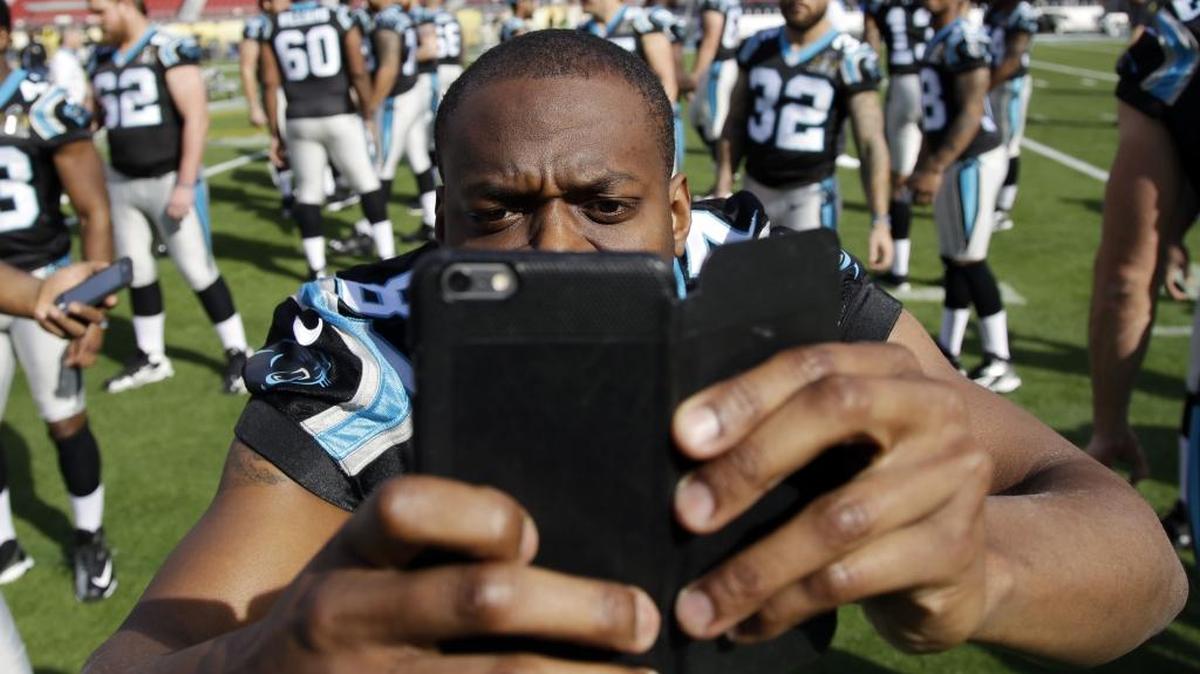 Carolina Panthers' Stephen Hill (87) takes photos of teammates inside Levi's Stadium on Saturday in preparation for Super Bowl 50.