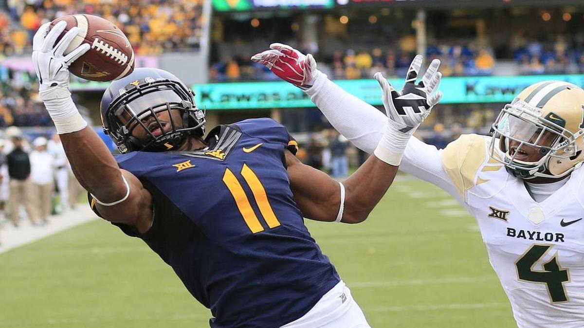 
West Virginia’s Kevin White (11) is a big, explosive wide receiver who had 109 catches as a senior. 
