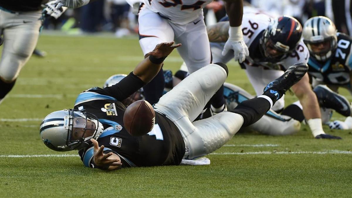 Panthers quarterback Cam Newton loses the ball as he is knocked to the ground during the first quarter of Super Bowl 50.